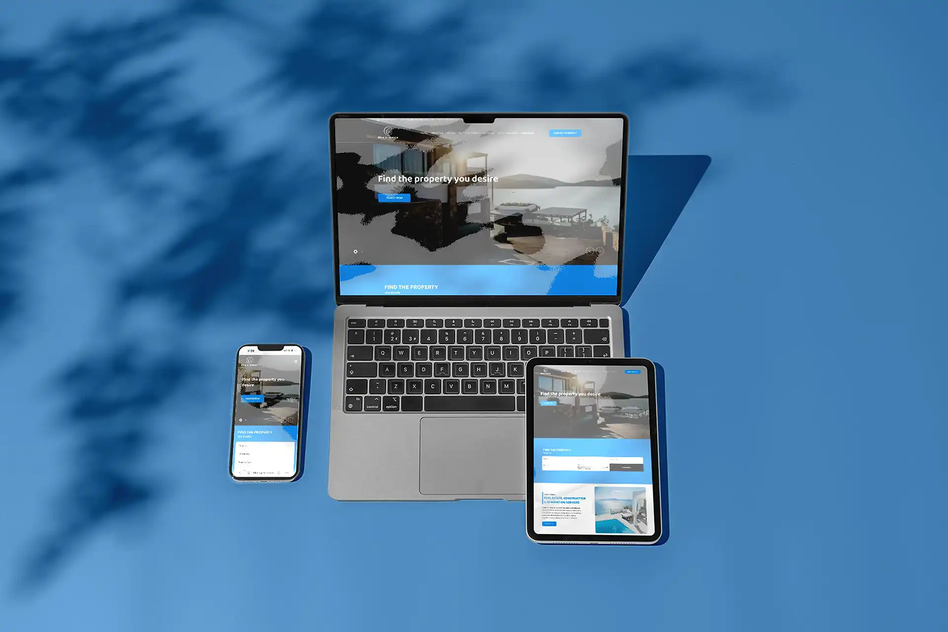 The Blue in Greece site shown on a laptop, phone and tablet against a deep-blue backdrop